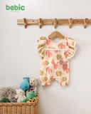 Bebic desert-themed clothing featuring earthy tones and desert-inspired patterns, displayed on a hanger against a plain background.