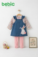 Baby girl wearing Bebic denim bunny pinafore set with playful bunny print and adjustable straps, styled with a white shirt underneath.