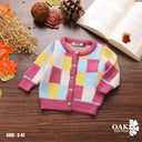 Bebic pastel patchwork cardigan featuring soft, colorful fabric with a cozy knit design and button closure.